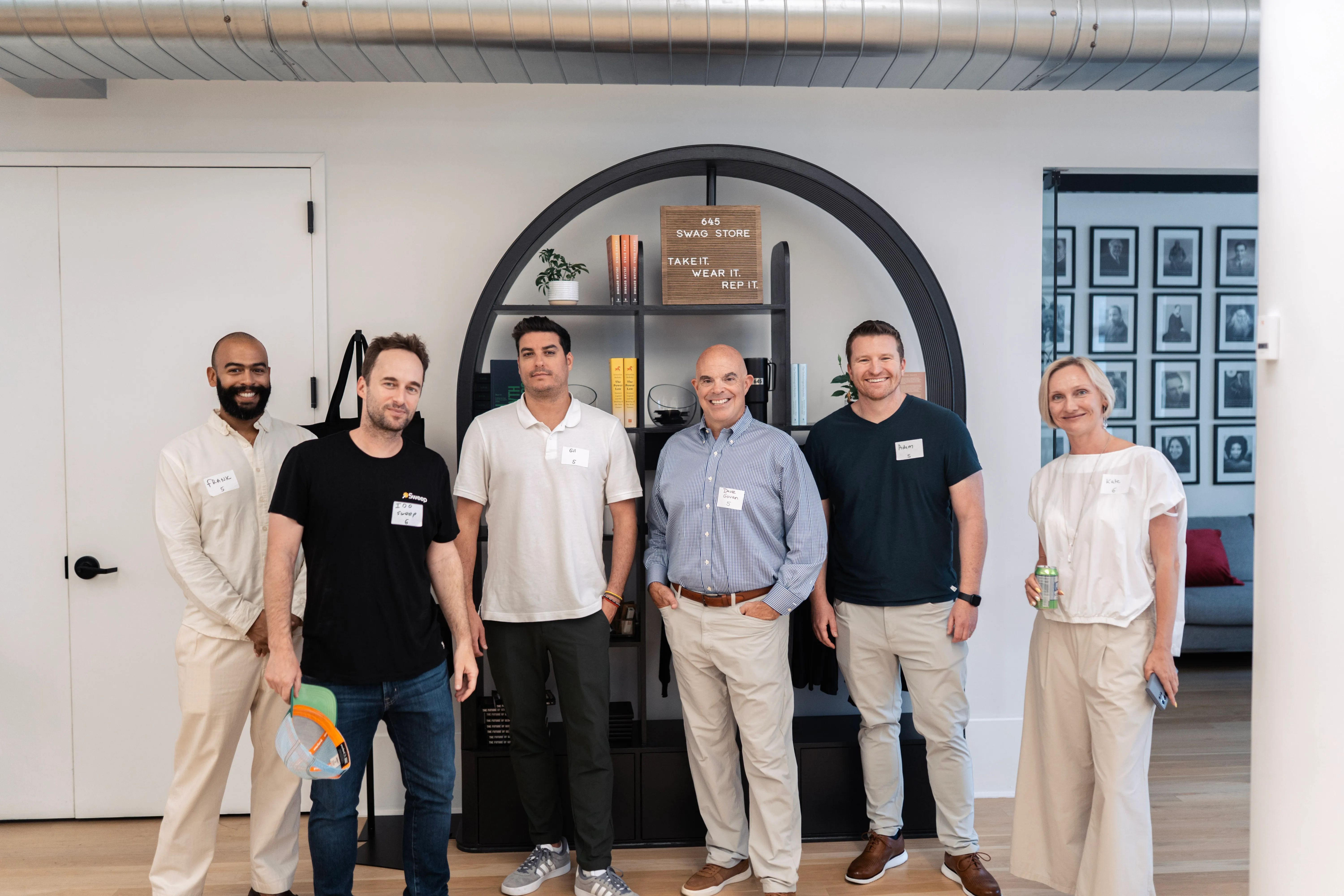 A small group of attendees standing together at a more intimate Alfa roundtable