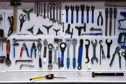 A pegboard wall neatly organized with a full set of tools